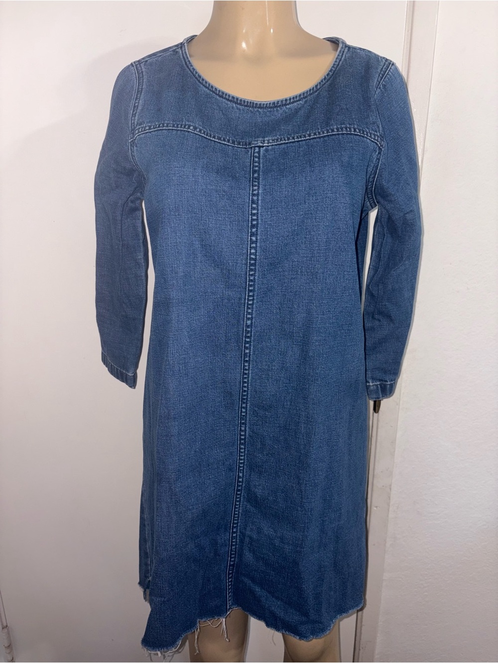 Madewell denim shift dress features a raw, frayed step hem and 3/4 sleeves